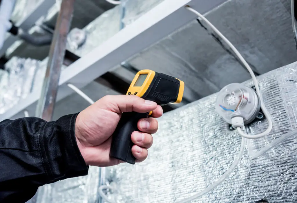Technician use infrared thermal imaging camera
